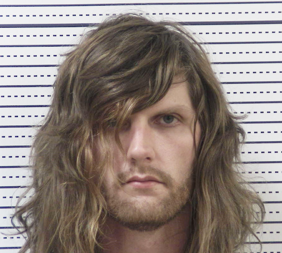 Police arrest man for allegedly shooting car containing kids